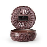 Lend warmth and ambience to your space with this softly scented three-wick candle from Voluspa. Smooth coconut-based wax blended with essential oils in a variety of scents is poured into a decorative tin pot. Lend warmth and ambience to your space with this softly scented three-wick candle from Voluspa. Smooth coconut-based wax blended with essential oils in a variety of scents is poured into a decorative tin pot.