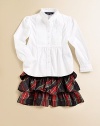 Traditional tartan plaid is crafted into a flirty tiered skirt accented with a flurry of ruffles for a fun, stylish touch.Elastic waistbandTiered ruffle constructionPolyesterDry cleanImported