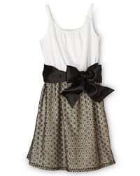 Delicate gold lace and a bow tie-waist make this Aqua Girls' dress holiday party-perfect. Delicate gold lace and a bow tie-waist make this Aqua Girls' dress holiday party-perfect.