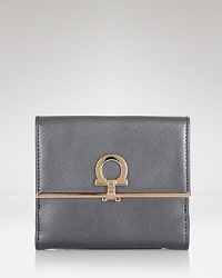 Pulled together perfection starts with practical accessories like this leather wallet from Salvatore Ferragamo. It's a beautiful accompaniment for every look with plenty of pockets to keep the essentials in place. Pulled together perfection starts with practical accessories like this leather wallet from Salvatore Ferragamo. It's a beautiful accompaniment for every look with plenty of pockets to keep the essentials in place.