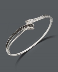 Let all the elements of style come together in this chic, contrasting bangle. Sterling silver bracelet features round-cut black diamonds (1/6 ct. t.w.) and white diamonds (1-1/10 ct. t.w.). Approximate diameter: 2-1/2 inches. Let all the elements of style come together in this chic, contrasting bangle. Sterling silver bracelet features round-cut black diamonds (1/6 ct. t.w.) and white diamonds (1-1/10 ct. t.w.). Approximate diameter: 2-1/2 inches.