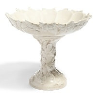 Delicate butterflies dance across this handmade fruit platter, highlighted by subtle variations in coloring. Delicate butterflies dance across this handmade fruit platter, highlighted by subtle variations in coloring.