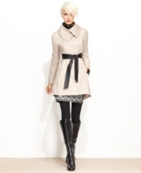 Looking for a sleek way to stay dry? Steve Madden's flared raincoat features a unique asymmetrical collar and a faux-leather belt for extra edge. Looking for a sleek way to stay dry? Steve Madden's flared raincoat features a unique asymmetrical collar and a faux-leather belt for extra edge.