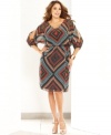 Snag a stylish office look with INC's split-sleeve plus size dress, defined by a blouson silhouette. (Clearance)