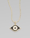 This protective evil eye, strung from a 14k yellow gold chain, is richly punctuated by a black diamond. Diamond, 0.2 tcw Enamel 14k yellow gold Chain length, about 16 Pendant width, about ½ Claw clasp Made in USA 