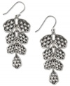 Add some flair to your everyday with these charming chandelier earrings from Lucky Brand. The alluring openwork design in pretty petal shapes delivers a chic look. Crafted in silver tone mixed metal. Approximate drop: 2 inches.