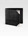 A simple bi-fold design receives a remarkably modern update, featuring six card slots and a billfold compartment, finished in exotic, croc-embossed leather.One billfold compartmentSix card slotsLeather5W x 4HImported