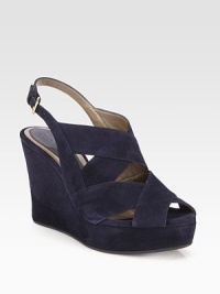 Ultra-high wedge design of buttery suede with skin-baring cutouts and an adjustable strap. Self-covered wedge, 4 (100mm)Suede upperAdjustable strapLeather liningRubber solePadded insoleMade in Italy Ultra-high wedge design of buttery suede with skin-baring cutouts and an adjustable strap. Self-covered wedge, 4 (100mm)Suede upperAdjustable strapLeather liningRubber solePadded insoleMade in Italy