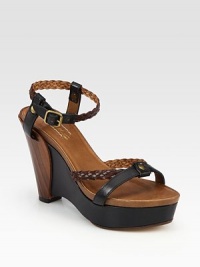 Braided straps cross smooth leather, concluding with an architectural wedge and adjustable ankle strap. Leather and wooden wedge, 4½ (115mm)Covered platform, 1 (25mm)Compares to a 3½ heel (90mm)Leather upperLeather lining and solePadded insoleMade in Italy Braided straps cross smooth leather, concluding with an architectural wedge and adjustable ankle strap. Leather and wooden wedge, 4½ (115mm)Covered platform, 1 (25mm)Compares to a 3½ heel (90mm)Leather upperLeather lining and solePadded insoleMade in Italy