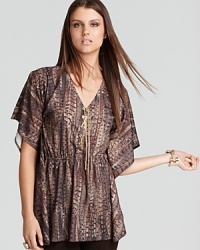 Try out this season's tribal trend in this MICHAEL Michael Kors top, finished with flutter sleeves and a gold-chain tie for an elegant look with exotic attitude. Try out this season's tribal trend in this MICHAEL Michael Kors top, finished with flutter sleeves and a gold-chain tie for an elegant look with exotic attitude.