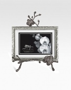A two-piece easel-style frame finds inspiration in the textures of nature, crafted in hammered and blackened nickel-plated metal by one of America's premier metalwork artists. From the Black Orchid CollectionOverall, 8 X 10½Accommodates a 4 X 6 or 5 X 7 photographImported 