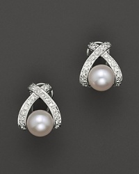 Classic cultured pearls are channel-set in an X design. Classic cultured pearls are channel-set in an X design.