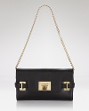 A versatile MICHAEL Michael Kors clutch with glamazon goldtone hardware and organized interior pockets.