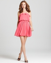 Femme ruffles at the neckline lend a flirtatious air to this Aqua strapless dress, making it a party-perfect style. Femme ruffles at the neckline lend a flirtatious air to this Aqua strapless dress, making it a party-perfect style.