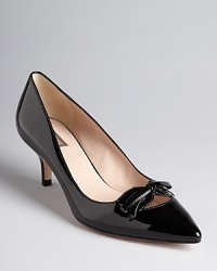 A cheeky bow adds a playful touch to Joan & David's Gila pumps, finished with a pointed toe and dainty kitten heel. A cheeky bow adds a playful touch to Joan & David's Gila pumps, finished with a pointed toe and dainty kitten heel.