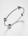From the Renaissance Collection. Let this beautiful piece take you back in time with faceted London blue topaz stations on an iconic sterling silver cable design. London blue topazSterling silverDiameter, about 2.25Slip-on styleImported 