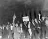 1938 photo Harlemites in anti-Nazi parade after the fight graphic. Carrying a placard demanding the ousting of Hitlers agents and spies, happy Harlemites stage an anti-nazi parade after Joe Louiss one-round victory over Max Schmeling, of Germany, in the