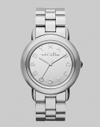 Smart and chic style with a mirror dial for added shine. Quartz movement Water resistant to 5 ATM Round stainless steel case, 36mm (1.4) Silver mirror logo dial Second hand Stainless steel link bracelet, 18mm wide (0.7) Imported 