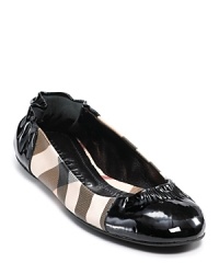 Burberry's take on the ballet flat makes for a chic shoe with check and patent leather details. Burberry's take on the ballet flat makes for a chic shoe with check and patent leather details.