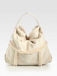 Luxurious dyed shearling in a soft and slouchy design.Double top handles, 6 dropMagnetic top closureOne inside zip pocketTwo inside open pocketsFully lined16W X 13H X 9DImported Luxurious dyed shearling in a soft and slouchy design.Double top handles, 6 dropMagnetic top closureOne inside zip pocketTwo inside open pocketsFully lined16W X 13H X 9DImported