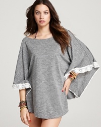 Heathered jersey meets crochet lace in Lucky Brand's poncho coverup. Balance the casual elegance with chic designer sunnies and delicate flat sandals. Heathered jersey meets crochet lace in Lucky Brand's poncho coverup. Balance the casual elegance with chic designer sunnies and delicate flat sandals.