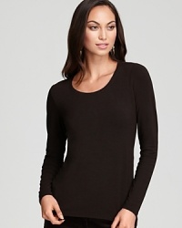 A chic scoop neckline and slim silhouette lend modern inspiration to an essential Eileen Fisher tee. A chic scoop neckline and slim silhouette lend modern inspiration to an essential Eileen Fisher tee.