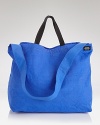 Grab your sunglasses, toss in all your essentials and head out for the day with this vibrant tote from Jack Spade. Featuring a packable interior pouch pocket, the tote compacts easily so you can travel abroad with it, too--a smart, stylish solution for carrying what you need anywhere you go.