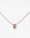 With a crystal-encrusted knot pendant, Chrislu's understated rose gold chain adds a delicate shot of sparkle to any look. Show it off against a dramatic neckline.
