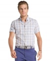 Kick-start your weekend wear with this slim-fit plaid Izod shirt designed to make you look good.