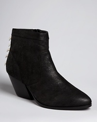 Sink your claws into one of the coolest, statement-making booties of the season, pairing a seemingly straightforward silhouette with boldly spiked backs; by Dolce Vita. Sink your claws into one of the coolest, statement-making booties of the season, pairing a seemingly straightforward silhouette with boldly spiked backs; by Dolce Vita.
