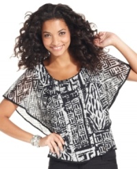 A femme silhouette and bold black-and-white print combine for a stunning effect on ECI's latest top. A femme silhouette and bold black-and-white print combine for a stunning effect on ECI's latest top.
