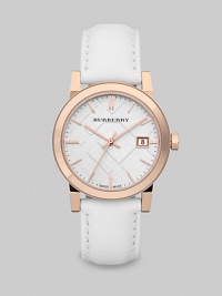 A clean and sleek timepiece with a supple leather strap, an ion-plated rose goldtone case and a sapphire crystal detail. Quartz movementWater resistant to 5 ATMRound ion-plated rose goldtone stainless steel case, 34mm (1.3)Smooth bezelWhite check stamped dialBar hour markersDate display at 3 o'clockSecond hand White leather strapMade in Switzerland A clean and sleek timepiece with a supple leather strap, an ion-plated rose goldtone case and a sapphire crystal detail. Quartz movementWater resistant to 5 ATMRound ion-plated rose goldtone stainless steel case, 34mm (1.3)Smooth bezelWhite check stamped dialBar hour markersDate display at 3 o'clockSecond hand White leather strapMade in Switzerland