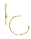 Do the delicate thing and swap your everyday studs for Melinda Maria's airy gold hoops. Hearts will melt.