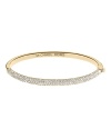 The charm of this thin Michael Kors bangle is all in the details--from the pave crusted front piece to the interior logo inscription.