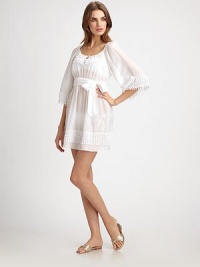Lovely layers of embellishments add feminine charm to this airy, belted coverup made from cotton and silk. Round neckButton closure on keyhole centerThree-quarter sleevesSelf-tie belt on elasticized waist70% cotton/30% silkDry cleanMade in USA of imported fabric Lovely layers of embellishments add feminine charm to this airy, belted coverup made from cotton and silk. Round neckButton closure on keyhole centerThree-quarter sleevesSelf-tie belt on elasticized waist70% cotton/30% silkDry cleanMade in USA of imported fabric