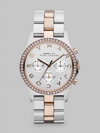 A versatile, two-tone timepiece with dazzling crystals and a signature dial. Quartz movementWater resistant to 5 ATMRound stainless steel case, 40mm (1.6)Crystal bezelSilvertone chronograph dialLogo markersDate display between 4 and 5 o'clockSecond hand Two-tone ion-plated stainless steel link braceletImported