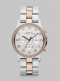 A versatile, two-tone timepiece with dazzling crystals and a signature dial. Quartz movementWater resistant to 5 ATMRound stainless steel case, 40mm (1.6)Crystal bezelSilvertone chronograph dialLogo markersDate display between 4 and 5 o'clockSecond hand Two-tone ion-plated stainless steel link braceletImported A versatile, two-tone timepiece with dazzling crystals and a signature dial. Quartz movementWater resistant to 5 ATMRound stainless steel case, 40mm (1.6)Crystal bezelSilvertone chronograph dialLogo markersDate display between 4 and 5 o'clockSecond hand Two-tone ion-plated stainless steel link braceletImported