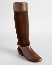 In soft brown suede and pebbled leather, Chloé's Marcie boots showcase an equestrian inspired silhouette with luxe logo details. In soft brown suede and pebbled leather, Chloé's Marcie boots showcase an equestrian inspired silhouette with luxe logo details.