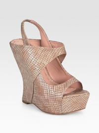 Wide straps and a posh snake print add an exotic spin to this leather slingback wedge. Self-covered wedge, 5½ (140mm)Covered platform, 1 (25mm)Compares to a 4½ heel (115mm)Snake-print leather upperLeather lining and solePadded insoleImportedOUR FIT MODEL RECOMMENDS ordering one half size up as this style runs small. Wide straps and a posh snake print add an exotic spin to this leather slingback wedge. Self-covered wedge, 5½ (140mm)Covered platform, 1 (25mm)Compares to a 4½ heel (115mm)Snake-print leather upperLeather lining and solePadded insoleImportedOUR FIT MODEL RECOMMENDS ordering one half size up as this style runs small.