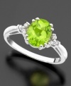 Pretty round-cut peridot (1-1/2 ct. t.w.) is a pleasing sight on this stunning ring accented with round-cut diamond accents set in 14k white gold.