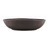 Featuring an organic shape and a matte glaze finish, this serving bowl is thoroughly modern and imparts natural sophistication.
