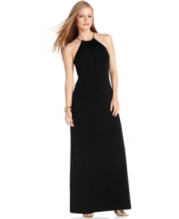 A dash of gleaming gold at the neckline of this Calvin Klein evening gown is a brilliant addition. Pair this dress with metallic heels for a luxe look from top to bottom. A dash of gleaming gold at the neckline of this Calvin Klein evening gown is a brilliant addition. Pair this dress with metallic heels for a luxe look from top to bottom.