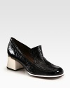 Traditional loafer-inspired pump in crinkled patent leather with a moderate block heel. Self-covered heel with metal insert, 2 (50mm)Crinkled patent leather upperLeather lining and solePadded insoleMade in Italy