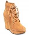 Lace up these beauties and go, go, go. BCBGeneration's Viktory lace-up platform wedge booties are made of sexy suede and feature a towering wedge heel.