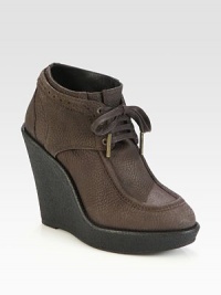 An elevated wedge design in textured nubuck leather, with traditional perforated details and metal-tip laces. Rubber wedge, 4¾ (120mm)Rubber platform, 1 (25mm)Compares to a 3¾ heel (95mm)Leather upperLeather liningRubber solePadded insoleMade in Italy An elevated wedge design in textured nubuck leather, with traditional perforated details and metal-tip laces. Rubber wedge, 4¾ (120mm)Rubber platform, 1 (25mm)Compares to a 3¾ heel (95mm)Leather upperLeather liningRubber solePadded insoleMade in Italy