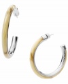 Welcome to the jungle! Safari-inspired styles are super hot this summer, and Michael Kors neutral-hued acetate horn hoops put the haute back into your favorite earring style. Set in silver tone mixed metal. Approximate diameter: 2 inches. Approximate width: 1/4 inch.