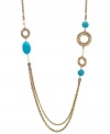 Looking to spruce up your resort wear? T Tahari's tropical-inspired style will have you looking like summer year round. This long, layered necklace features cut-out rings with ivory and turquoise-hued resin beads. Crafted in antique gold tone mixed metal. Base metal is nickel-free for sensitive skin. Approximate length: 36 inches.