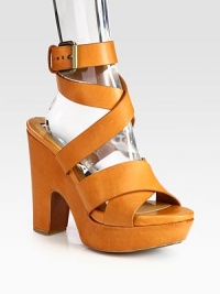 Soft leather style with a chunky block heel and adjustable criss-cross straps. Self-covered heel, 4½ (140mm)Covered platform, 1½ (40mm)Compares to a 3 heel (75mm)Leather upperLeather lining and solePadded insoleMade in ItalyOUR FIT MODEL RECOMMENDS ordering one half size up as this style runs small. Soft leather style with a chunky block heel and adjustable criss-cross straps. Self-covered heel, 4½ (140mm)Covered platform, 1½ (40mm)Compares to a 3 heel (75mm)Leather upperLeather lining and solePadded insoleMade in ItalyOUR FIT MODEL RECOMMENDS ordering one half size up as this style runs small.