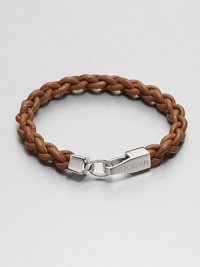A braided strand of genuine leather is offset by a shiny, sterling silver clasp.LeatherSterling silverAbout 2½ diam.Made in the United Kingdom A braided strand of genuine leather is offset by a shiny, sterling silver clasp.LeatherSterling silverAbout 2½ diam.Made in the United Kingdom