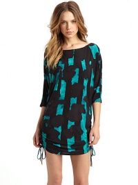 THE LOOKAbstract print, alloverThree-quarter length sleevesShirred detail along sides with tie closurePullover styleTHE MATERIAL92% nylon/8% spandexFully linedCARE & ORIGINHand washImportedModel shown is 5'9 (175cm) wearing US size Small. THE LOOKAbstract print, alloverThree-quarter length sleevesShirred detail along sides with tie closurePullover styleTHE MATERIAL92% nylon/8% spandexFully linedCARE & ORIGINHand washImportedModel shown is 5'9 (175cm) wearing US size Small.